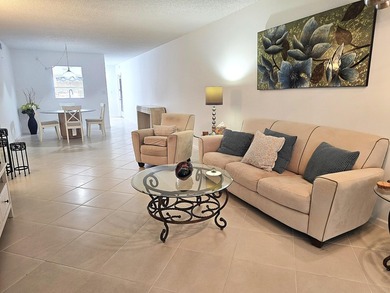 STEP INTO THE SIMPLE ELEGANCE OF THIS GROUND FLOOR CORNER IN on Wynmoor Golf Course in Florida - for sale on GolfHomes.com, golf home, golf lot