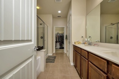 This beautifully maintained corner lot half duplex home is on Wildhorse Golf Club of Robson Ranch in Texas - for sale on GolfHomes.com, golf home, golf lot