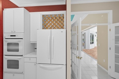 THIS LOVELY LAKEFRONT HOME IS SITUATED IN EATON PLACE, WHICH IS on University Park Country Club in Florida - for sale on GolfHomes.com, golf home, golf lot