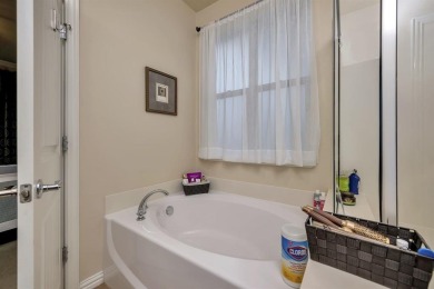 This beautifully maintained corner lot half duplex home is on Wildhorse Golf Club of Robson Ranch in Texas - for sale on GolfHomes.com, golf home, golf lot