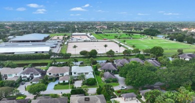 Nestled on one of the polo club's most picturesque streets, this on Palm Beach Polo and Country Club in Florida - for sale on GolfHomes.com, golf home, golf lot