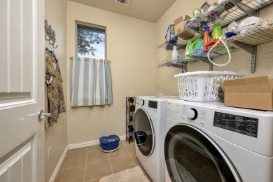 This beautifully maintained corner lot half duplex home is on Wildhorse Golf Club of Robson Ranch in Texas - for sale on GolfHomes.com, golf home, golf lot