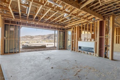 Available by winter 2025, this custom 2-story home is under on Dragon Ridge Country Club in Nevada - for sale on GolfHomes.com, golf home, golf lot