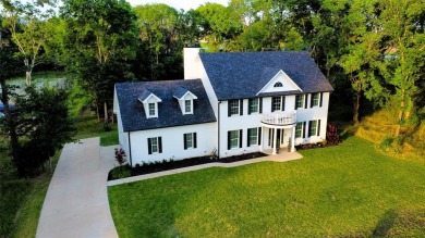 Welcome to this exquisite colonial home nestled in a serene on Cedar Creek Country Club in Texas - for sale on GolfHomes.com, golf home, golf lot