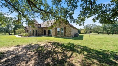 Only 50 miles from Dallas, this gorgeous stone brick home was on Indian Oaks Golf Club in Texas - for sale on GolfHomes.com, golf home, golf lot