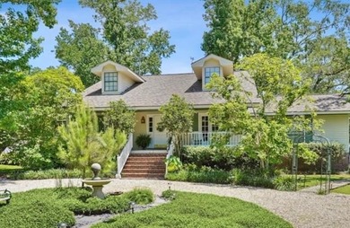 Lovely raised Acadian cottage on an oversized lot fronting the on Covington Country Club in Louisiana - for sale on GolfHomes.com, golf home, golf lot