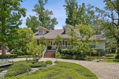 Lovely raised Acadian cottage on an oversized lot fronting the on Covington Country Club in Louisiana - for sale on GolfHomes.com, golf home, golf lot
