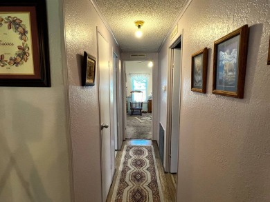 Discover the charm of this exceptional property, featuring:    - on Lake Henry Golf Club in Florida - for sale on GolfHomes.com, golf home, golf lot