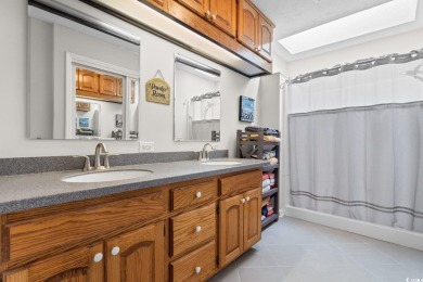Welcome to this charming 4-bedroom, 3-bathroom fully furnished on Surf Golf and Beach Club in South Carolina - for sale on GolfHomes.com, golf home, golf lot
