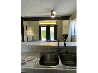 Turnkey, end unit loft condo, with views of the waterway, tennis on Indian Palms Country Club and Resort in California - for sale on GolfHomes.com, golf home, golf lot