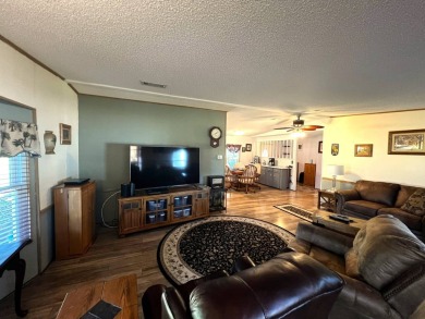 Discover the charm of this exceptional property, featuring:    - on Lake Henry Golf Club in Florida - for sale on GolfHomes.com, golf home, golf lot