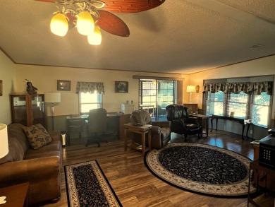 Discover the charm of this exceptional property, featuring:    - on Lake Henry Golf Club in Florida - for sale on GolfHomes.com, golf home, golf lot
