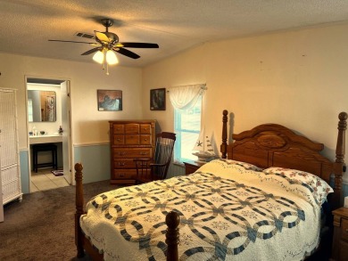 Discover the charm of this exceptional property, featuring:    - on Lake Henry Golf Club in Florida - for sale on GolfHomes.com, golf home, golf lot