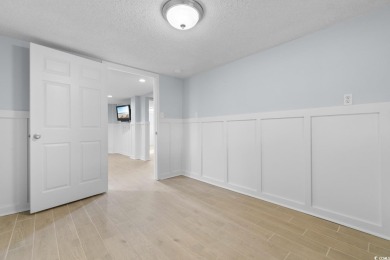 Welcome to this charming 4-bedroom, 3-bathroom fully furnished on Surf Golf and Beach Club in South Carolina - for sale on GolfHomes.com, golf home, golf lot