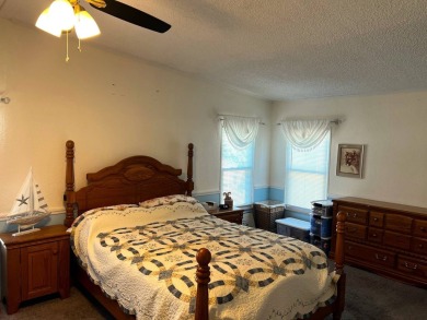 Discover the charm of this exceptional property, featuring:    - on Lake Henry Golf Club in Florida - for sale on GolfHomes.com, golf home, golf lot