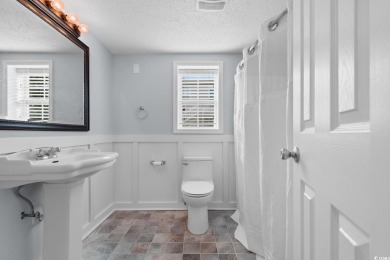 Welcome to this charming 4-bedroom, 3-bathroom fully furnished on Surf Golf and Beach Club in South Carolina - for sale on GolfHomes.com, golf home, golf lot