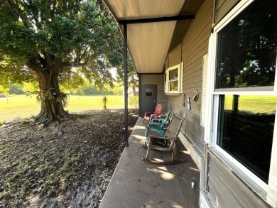 Discover the charm of this exceptional property, featuring:    - on Lake Henry Golf Club in Florida - for sale on GolfHomes.com, golf home, golf lot