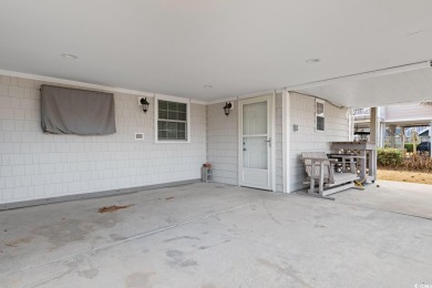 Welcome to this charming 4-bedroom, 3-bathroom fully furnished on Surf Golf and Beach Club in South Carolina - for sale on GolfHomes.com, golf home, golf lot