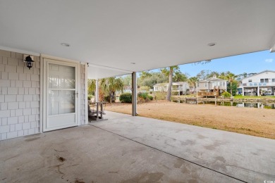 Welcome to this charming 4-bedroom, 3-bathroom fully furnished on Surf Golf and Beach Club in South Carolina - for sale on GolfHomes.com, golf home, golf lot