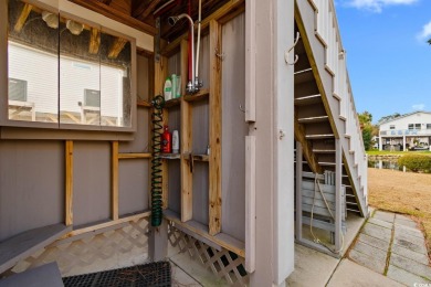 Welcome to this charming 4-bedroom, 3-bathroom fully furnished on Surf Golf and Beach Club in South Carolina - for sale on GolfHomes.com, golf home, golf lot