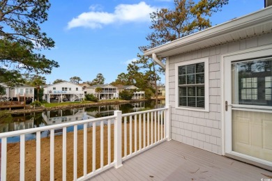 Welcome to this charming 4-bedroom, 3-bathroom fully furnished on Surf Golf and Beach Club in South Carolina - for sale on GolfHomes.com, golf home, golf lot