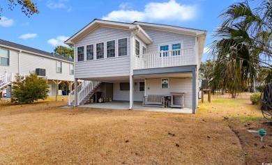 Welcome to this charming 4-bedroom, 3-bathroom fully furnished on Surf Golf and Beach Club in South Carolina - for sale on GolfHomes.com, golf home, golf lot
