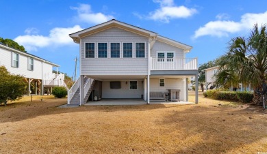 Welcome to this charming 4-bedroom, 3-bathroom fully furnished on Surf Golf and Beach Club in South Carolina - for sale on GolfHomes.com, golf home, golf lot