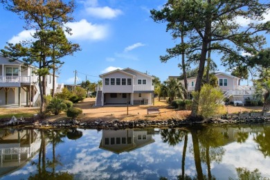 Welcome to this charming 4-bedroom, 3-bathroom fully furnished on Surf Golf and Beach Club in South Carolina - for sale on GolfHomes.com, golf home, golf lot