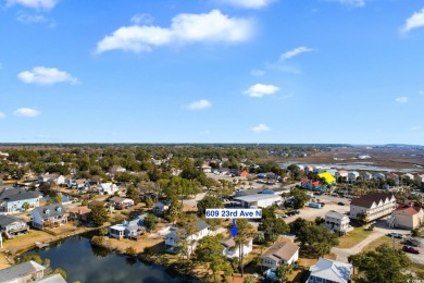 Welcome to this charming 4-bedroom, 3-bathroom fully furnished on Surf Golf and Beach Club in South Carolina - for sale on GolfHomes.com, golf home, golf lot