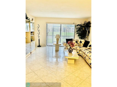 THIS IS A CONVENIENT GROUND FLOOR CORNER UNIT , IN A GATED 55+ on Sunrise Lakes Phase IV Golf Course in Florida - for sale on GolfHomes.com, golf home, golf lot
