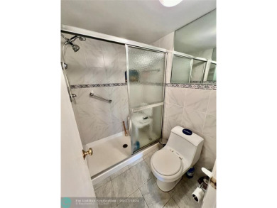 THIS IS A CONVENIENT GROUND FLOOR CORNER UNIT , IN A GATED 55+ on Sunrise Lakes Phase IV Golf Course in Florida - for sale on GolfHomes.com, golf home, golf lot