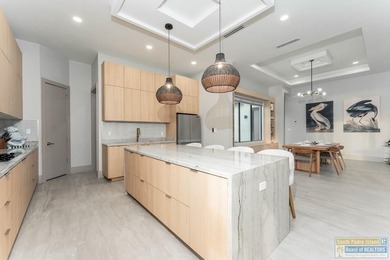 Stunning modern home built in 2022, located in the SPI golf on South Padre Island Golf Club in Texas - for sale on GolfHomes.com, golf home, golf lot