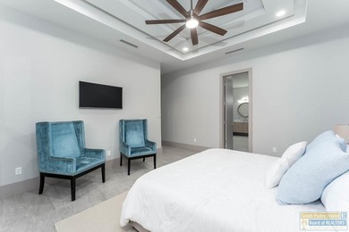 Stunning modern home built in 2022, located in the SPI golf on South Padre Island Golf Club in Texas - for sale on GolfHomes.com, golf home, golf lot