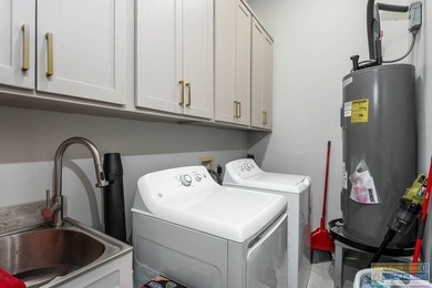 Stunning modern home built in 2022, located in the SPI golf on South Padre Island Golf Club in Texas - for sale on GolfHomes.com, golf home, golf lot