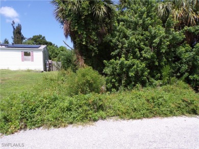 This lot is on a quiet street that would be a great place to on Twin Isles Country Club in Florida - for sale on GolfHomes.com, golf home, golf lot