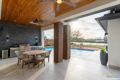 Stunning modern home built in 2022, located in the SPI golf on South Padre Island Golf Club in Texas - for sale on GolfHomes.com, golf home, golf lot