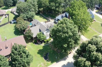 RIVER OAKS CHARMER with a beautiful in-ground pool area! Located on The Course at River Oaks in Arkansas - for sale on GolfHomes.com, golf home, golf lot