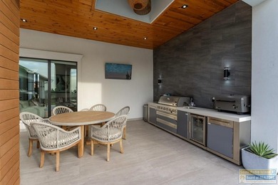 Stunning modern home built in 2022, located in the SPI golf on South Padre Island Golf Club in Texas - for sale on GolfHomes.com, golf home, golf lot