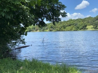 Lake Front Lot on Almost 1/2 Acre Lot on Small Private Lake on Raintree Country Club in Missouri - for sale on GolfHomes.com, golf home, golf lot