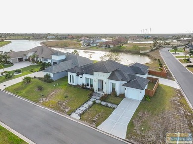 Stunning modern home built in 2022, located in the SPI golf on South Padre Island Golf Club in Texas - for sale on GolfHomes.com, golf home, golf lot