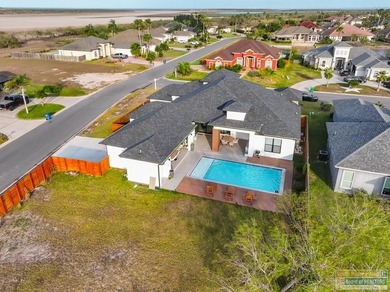 Stunning modern home built in 2022, located in the SPI golf on South Padre Island Golf Club in Texas - for sale on GolfHomes.com, golf home, golf lot