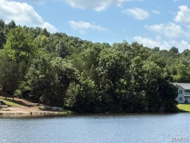 Lake Front Lot on Almost 1/2 Acre Lot on Small Private Lake on Raintree Country Club in Missouri - for sale on GolfHomes.com, golf home, golf lot