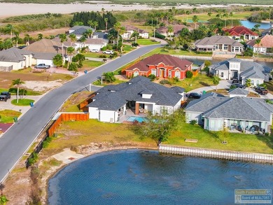 Stunning modern home built in 2022, located in the SPI golf on South Padre Island Golf Club in Texas - for sale on GolfHomes.com, golf home, golf lot