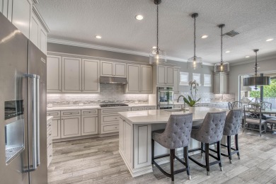This residence is thoughtfully designed for seamless on Jupiter Country Club in Florida - for sale on GolfHomes.com, golf home, golf lot