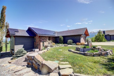 Welcome to this beautiful custom-built home in the Mission Bay on Polson Bay Golf Course - Championship Course in Montana - for sale on GolfHomes.com, golf home, golf lot