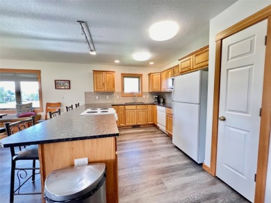 Welcome to low-maintenance luxury living in the heart of Mission on Polson Bay Golf Course - Championship Course in Montana - for sale on GolfHomes.com, golf home, golf lot
