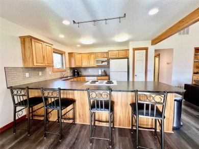 Welcome to low-maintenance luxury living in the heart of Mission on Polson Bay Golf Course - Championship Course in Montana - for sale on GolfHomes.com, golf home, golf lot