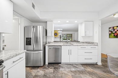 Look at this beautiful first-floor condo with a private garage on Boca Pointe Country Club in Florida - for sale on GolfHomes.com, golf home, golf lot