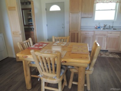 Just pack your bags and move right in to this immaculate totally on Nahma Club in Michigan - for sale on GolfHomes.com, golf home, golf lot