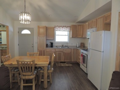 Just pack your bags and move right in to this immaculate totally on Nahma Club in Michigan - for sale on GolfHomes.com, golf home, golf lot